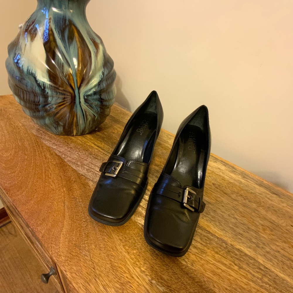 Black leather pumps